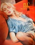 Blonde in blue satin robe on couch
