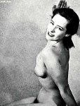 Curvy girl turning to smile at camera